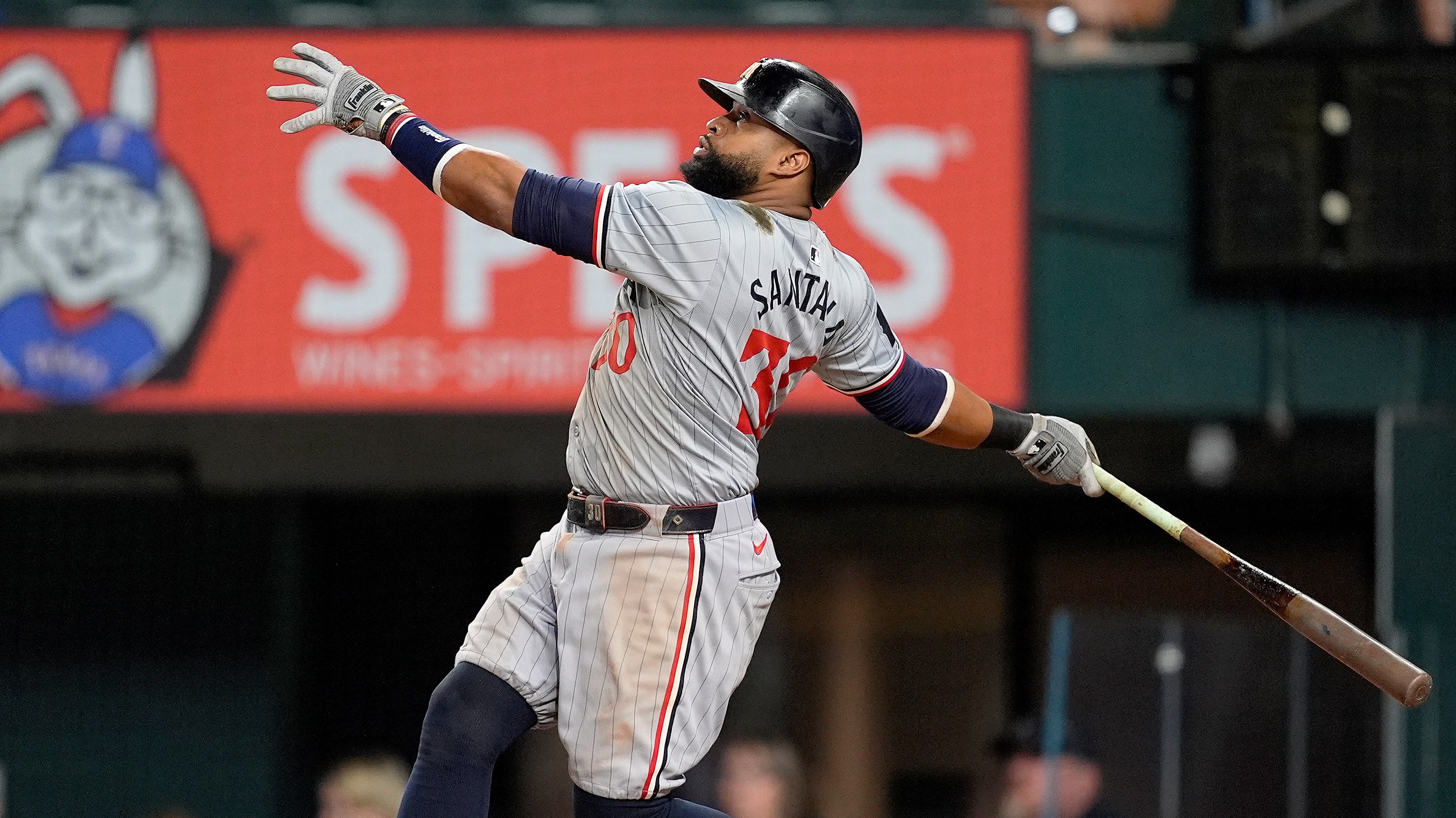 Carlos Santana watches the flight of ball off his bat