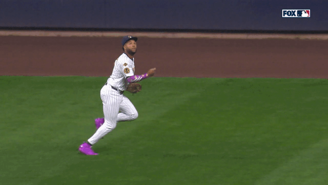 An animated gif of Jackson Chourio making a diving catch