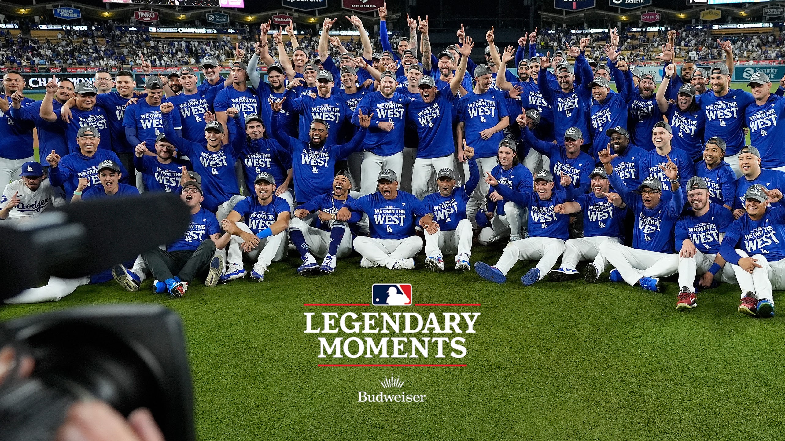 The Dodgers pose for a team photo on the field after winning the NL West