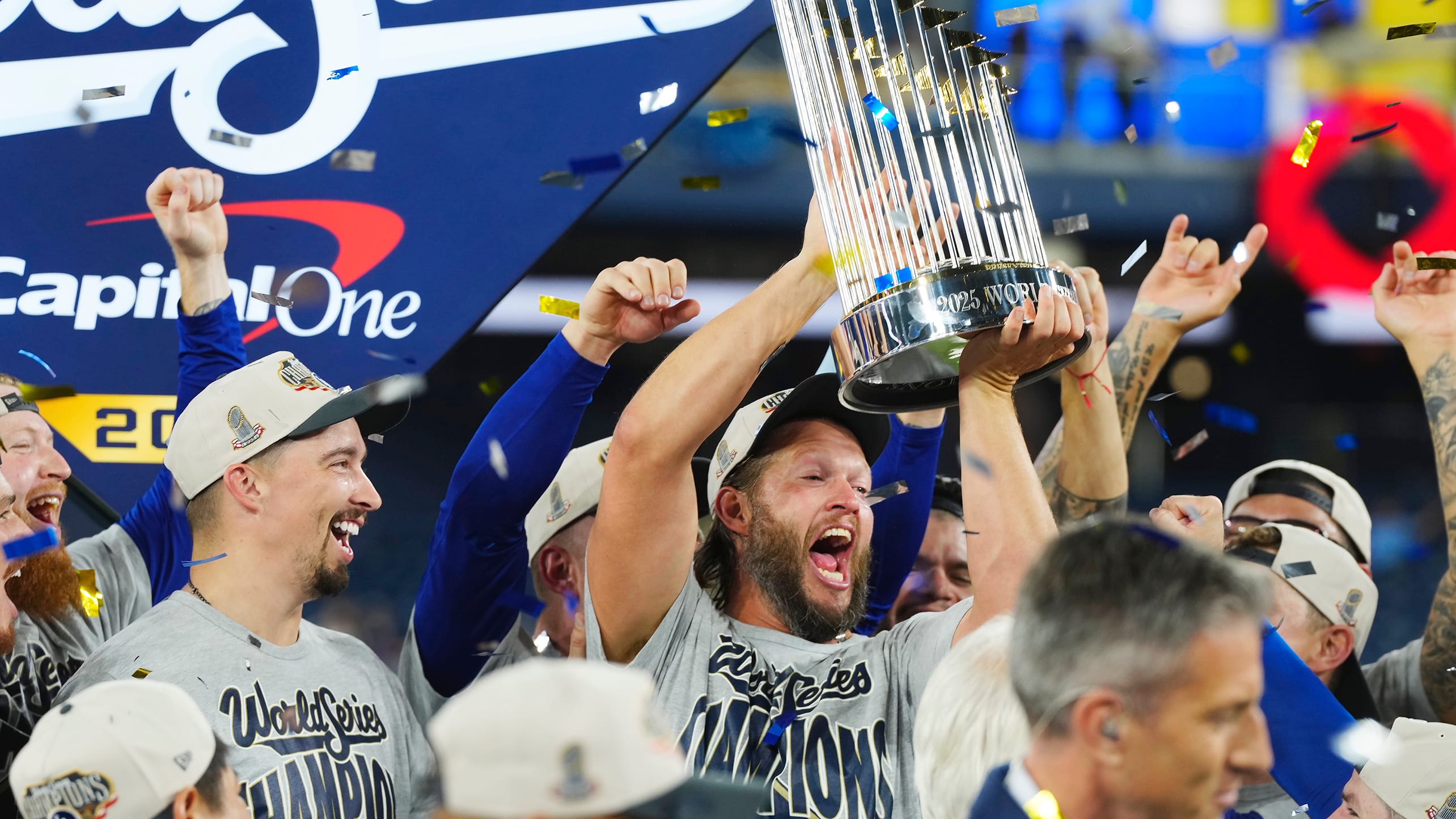 Clayton Kershaw holds up the World Series trophy