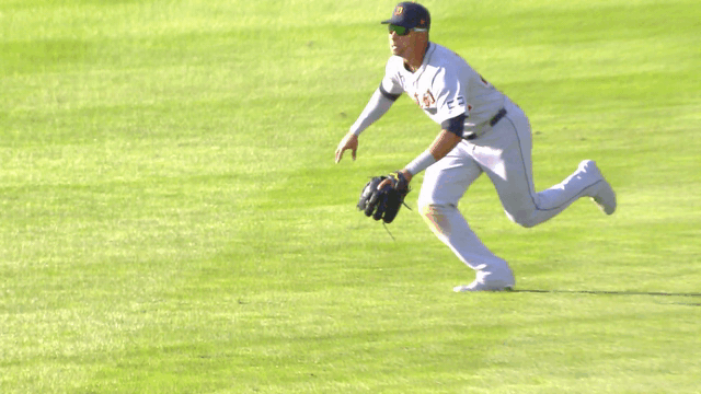 An animated gif of Justyn-Henry Malloy running in to make a diving catch
