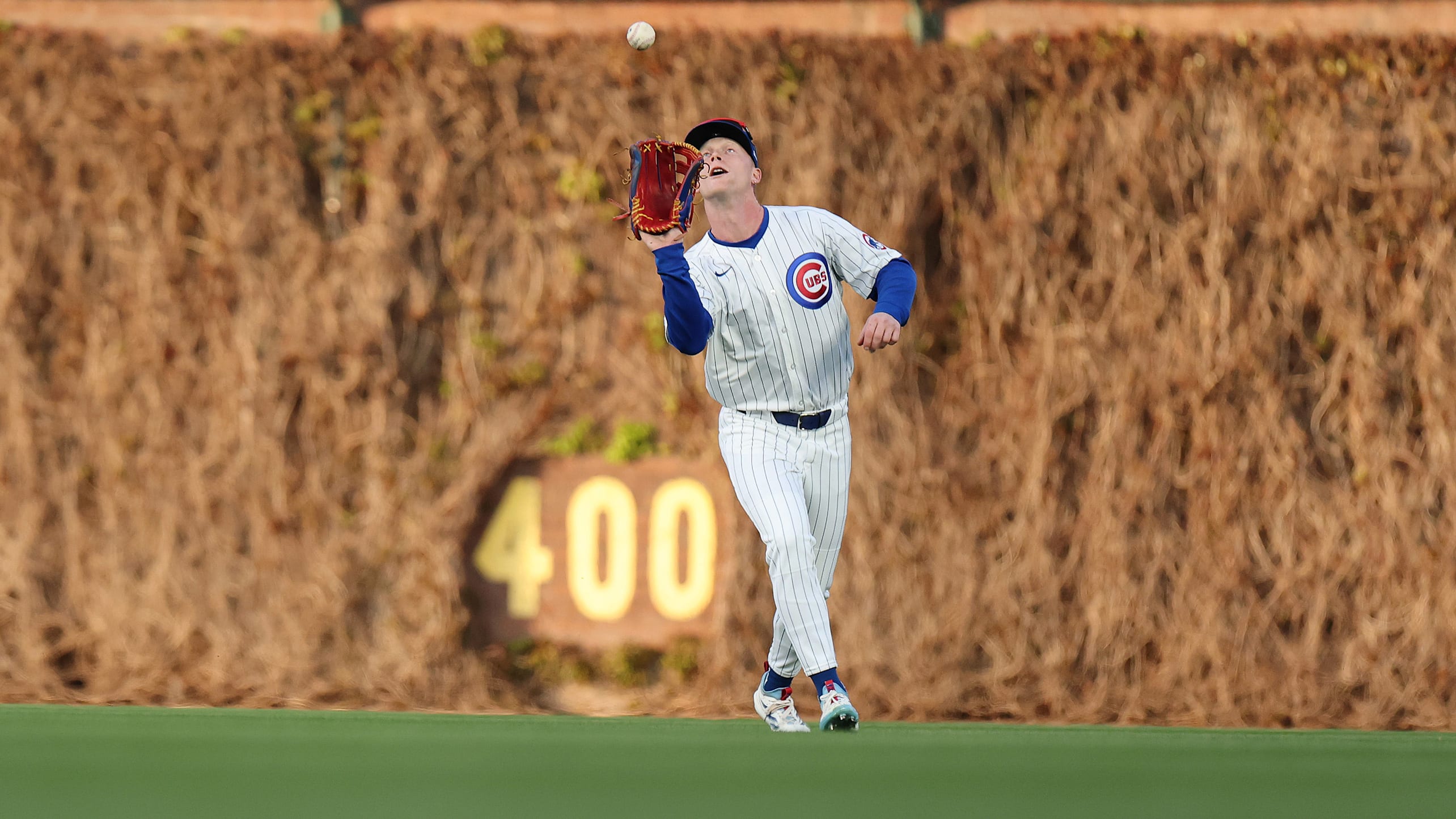 Pete Crow-Armstrong watches a fly ball into his glove