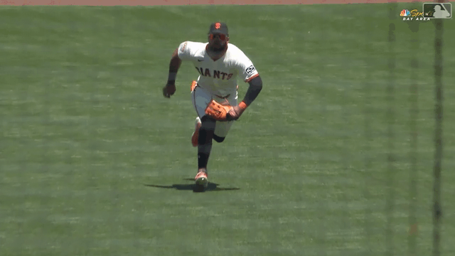 An animated gif of Heliot Ramos making a diving catch