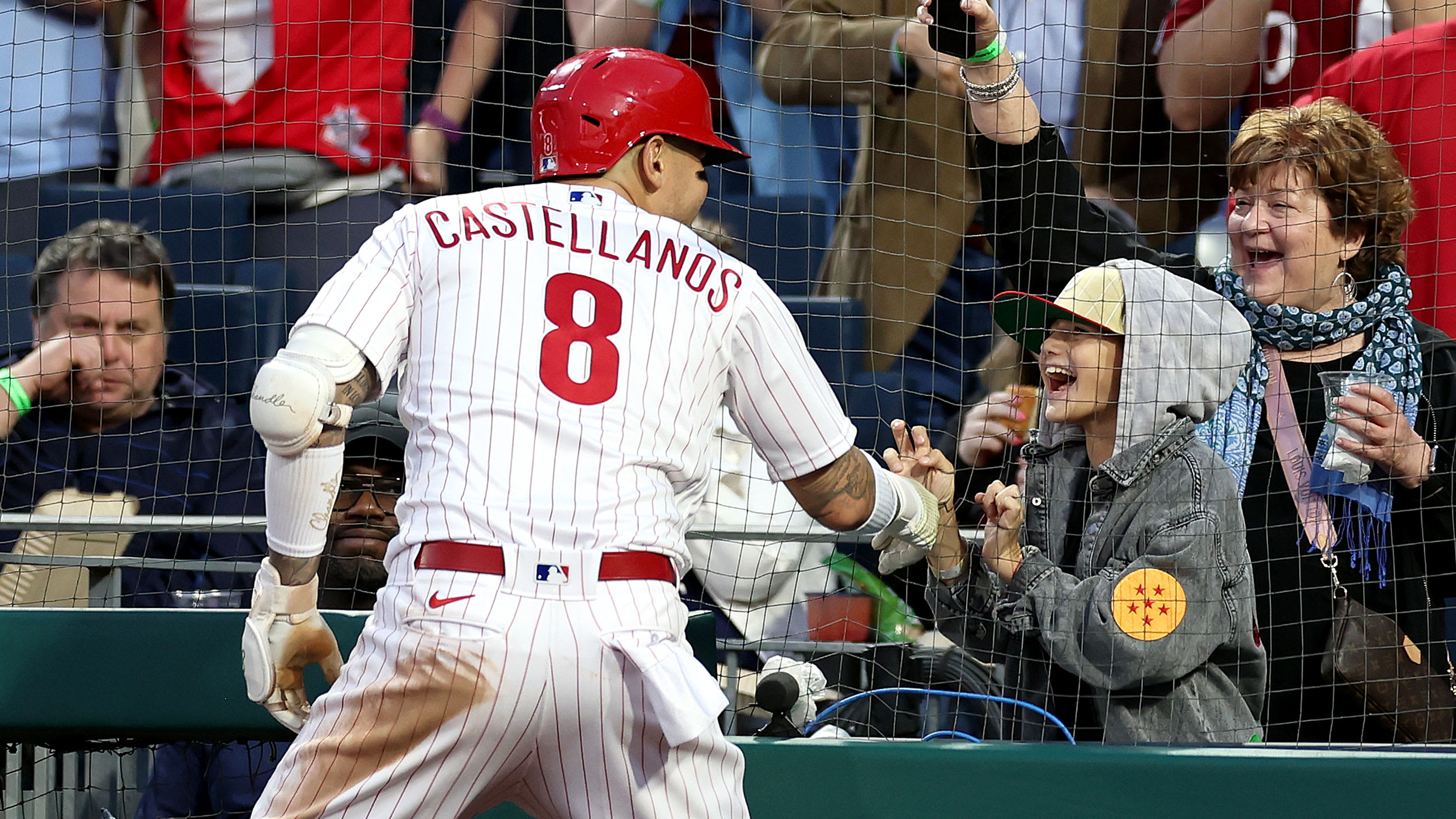 Nick Castellano greets his son Liam near the stands