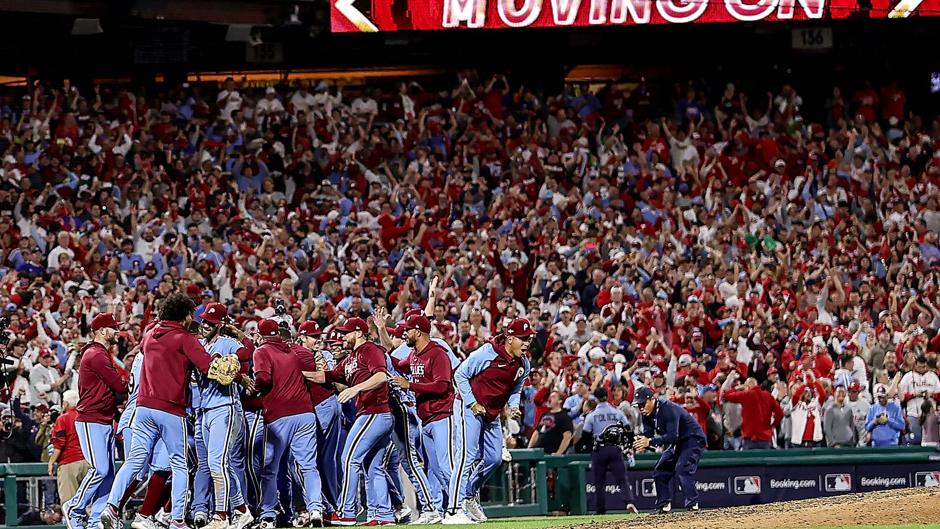 The Phillies celebrate their victory in front of a raucous crowd