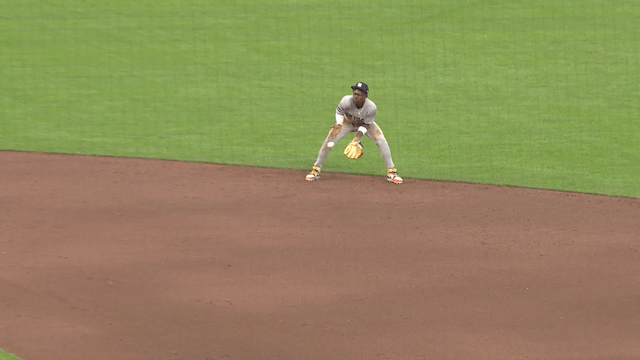 An animated gif of a line drive popping out of Jazz Chisholm Jr.'s glove and his quick reaction to catch it with his bare hand 