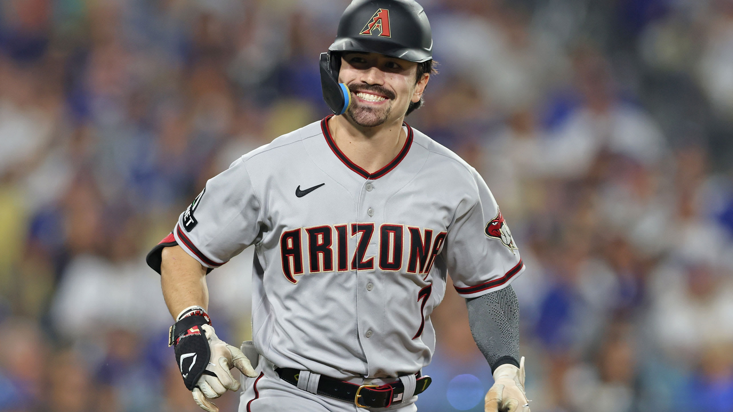 Corbin Carroll sports a wide smile after hitting a home run