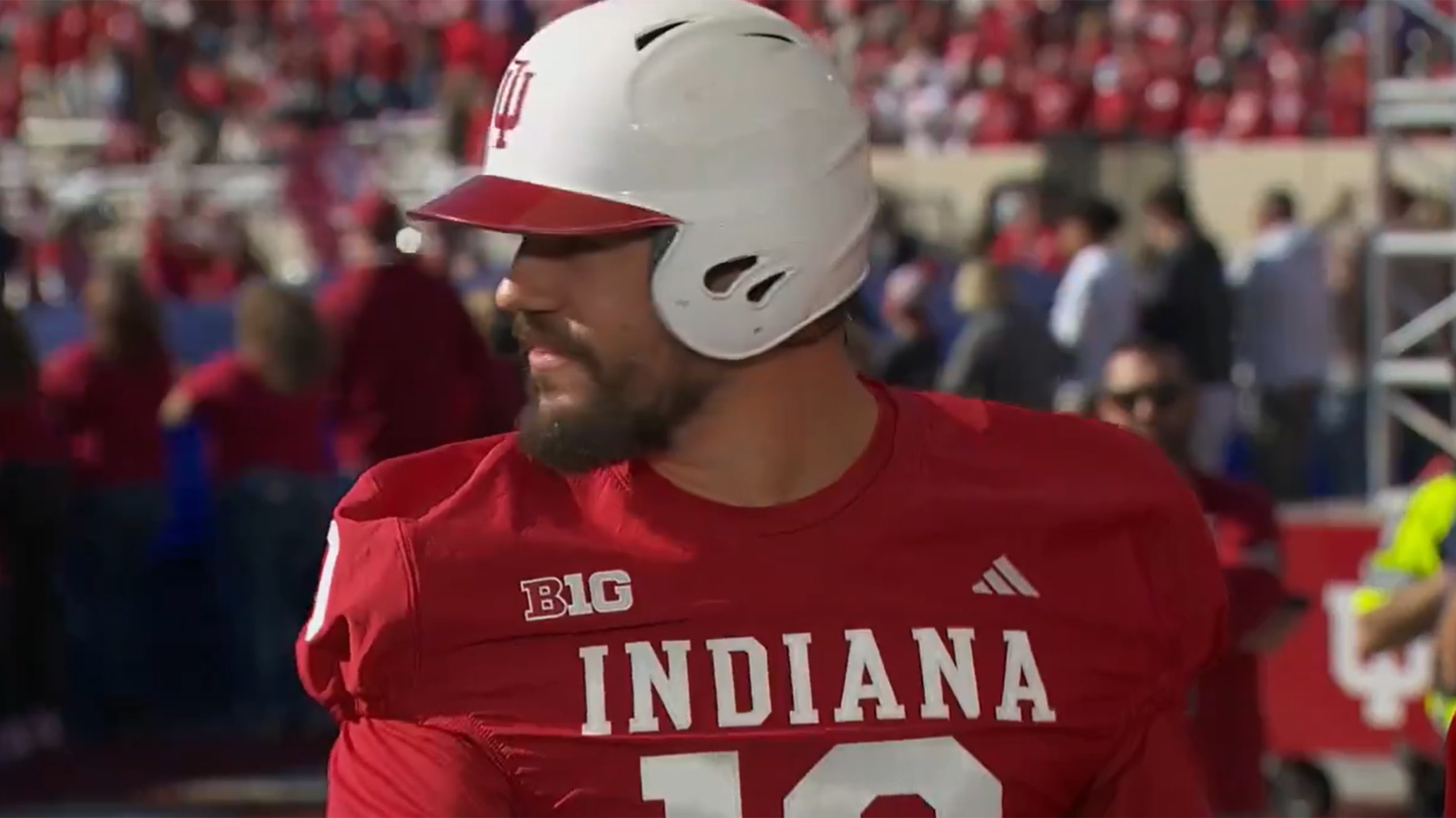 Kyle Schwarber donned an Indiana University baseball helmet and football uniform on Saturday