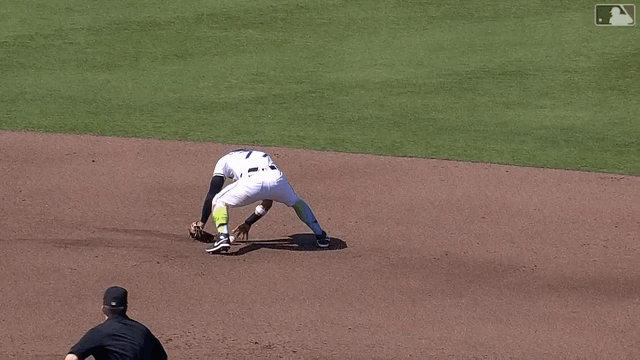 An animated gif of José Caballero flipping the ball between his legs to start a double play
