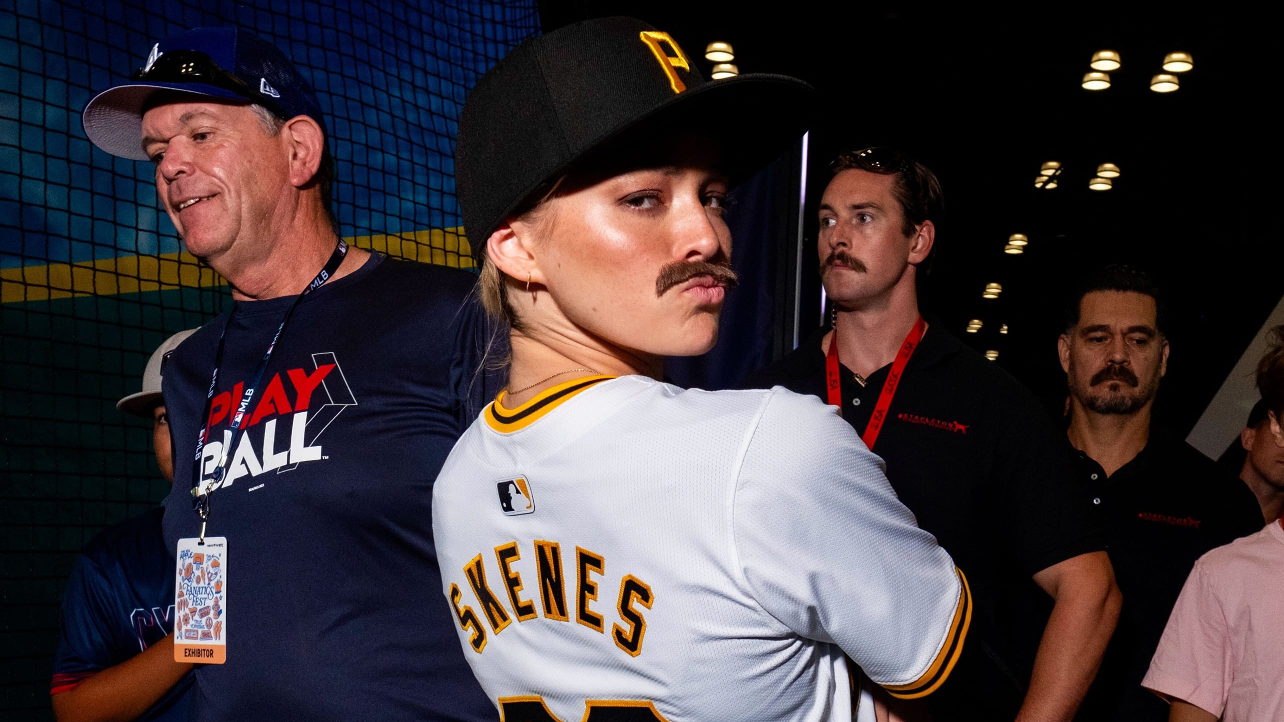 Livvy Dunne wearing a Paul Skenes jersey, Pirates cap and fake mustache