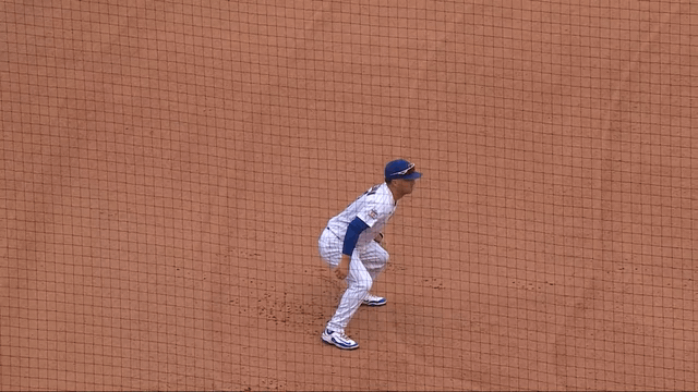 An animated gif of Alex Bregman making a diving stop and throw 