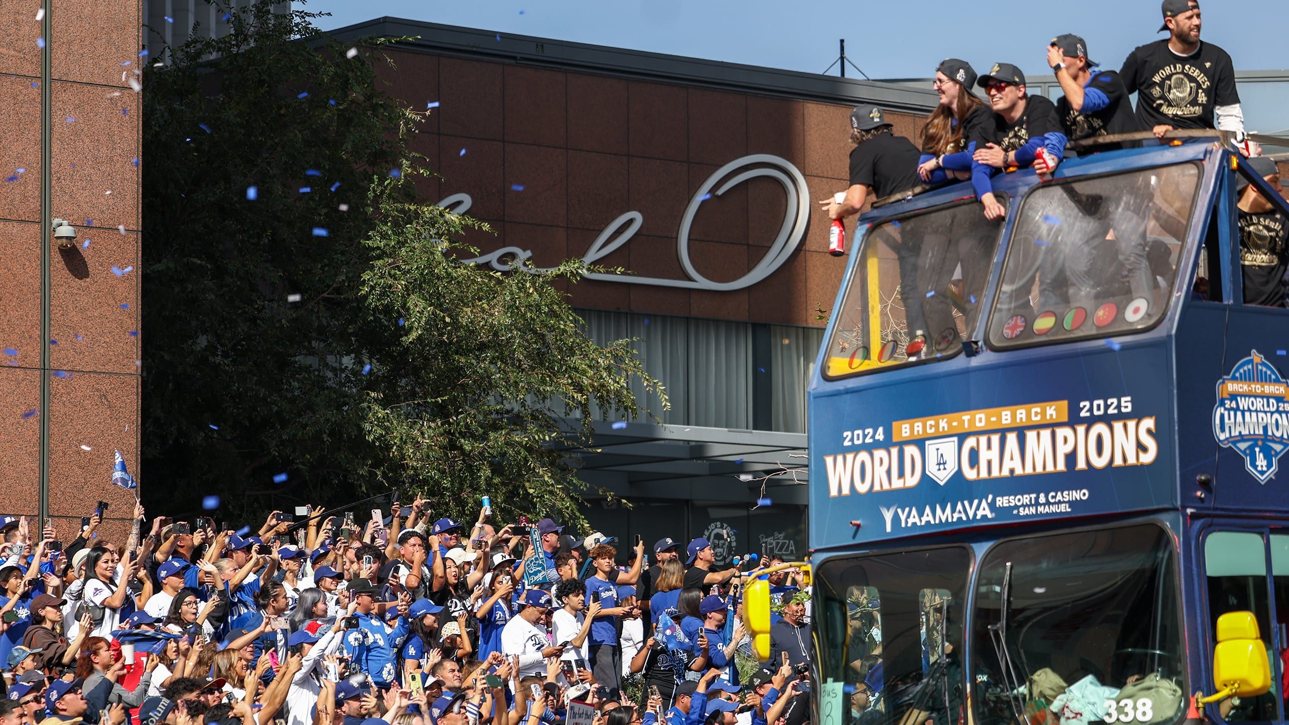 Fans cheer for the Dodgers as they ride by on a double-decker bus during the 2025 championship parade