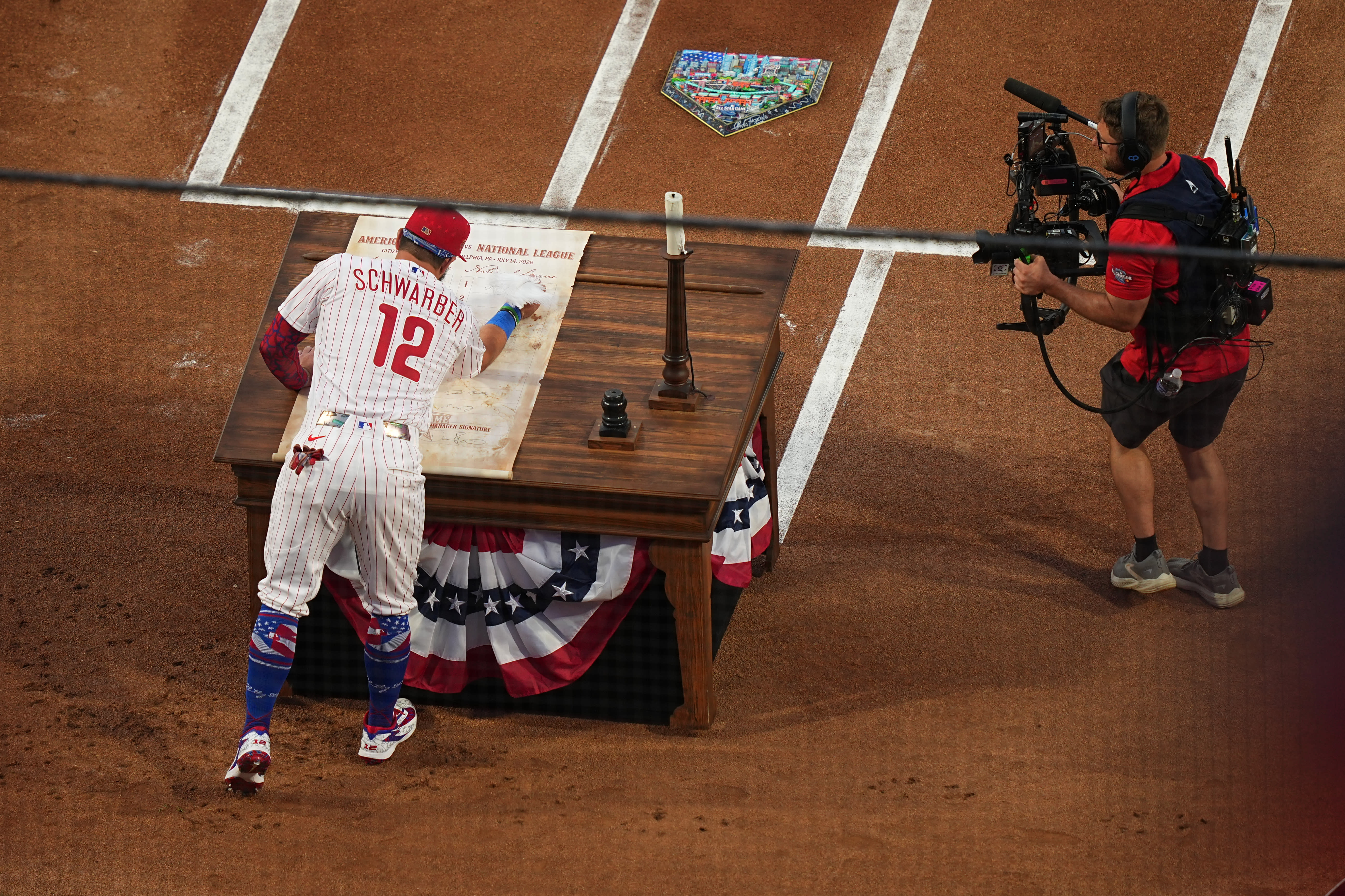 Kyle Schwarber signs the All-Star Game's Declaration of Independence-style lineup card