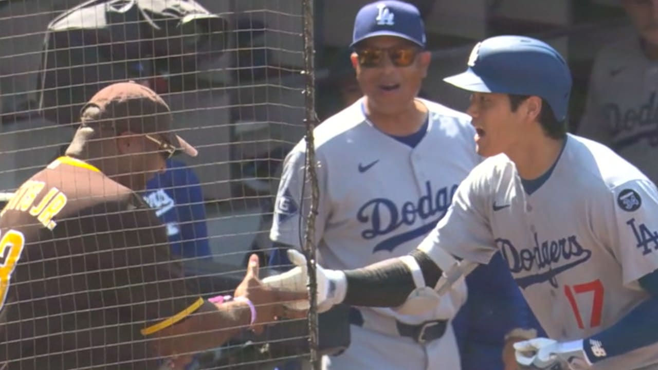Shohei Ohtani high-fives a heckler