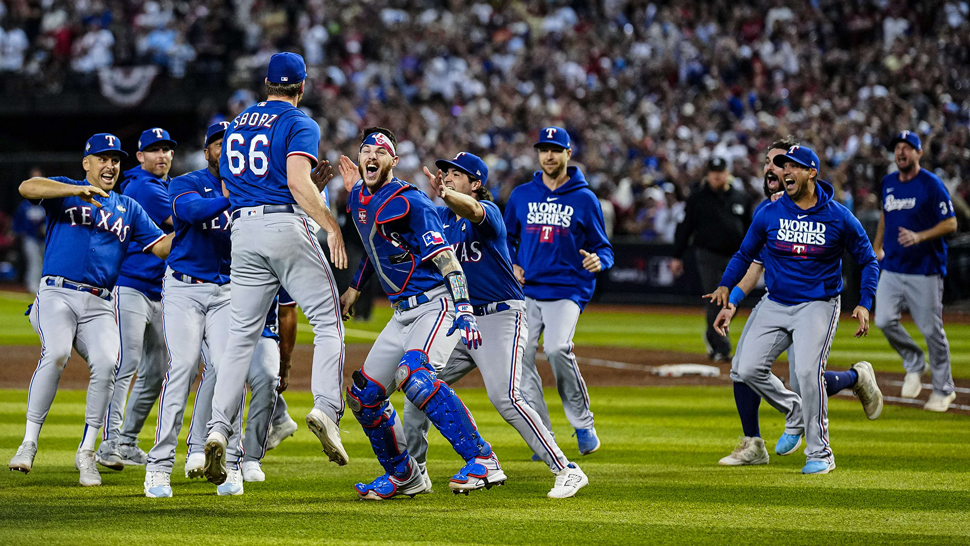 The Rangers celebrate after winning the World Series