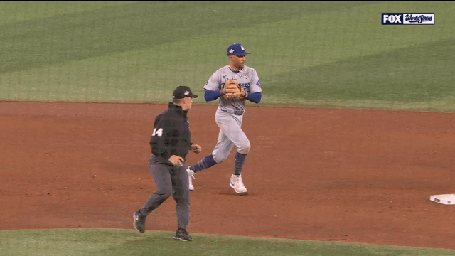 An animated gif of Mookie Betts starting the game-ending double play