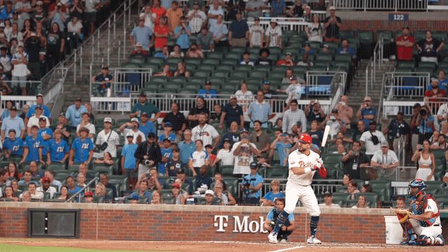 An animated gif of Kyle Schwarber hitting a home run and dropping to one knee