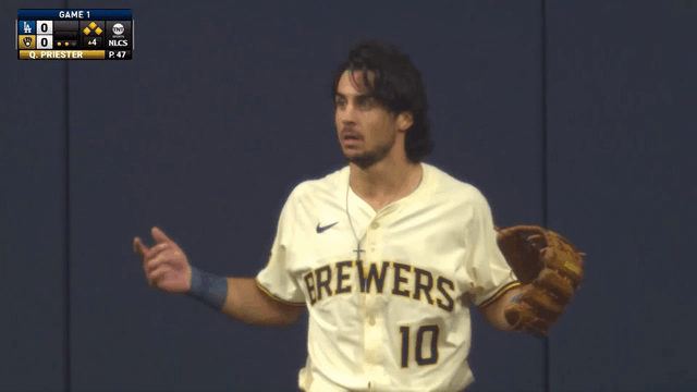 An animated gif of Brewers center fielder Sal Frelick holding out his arms in confusion