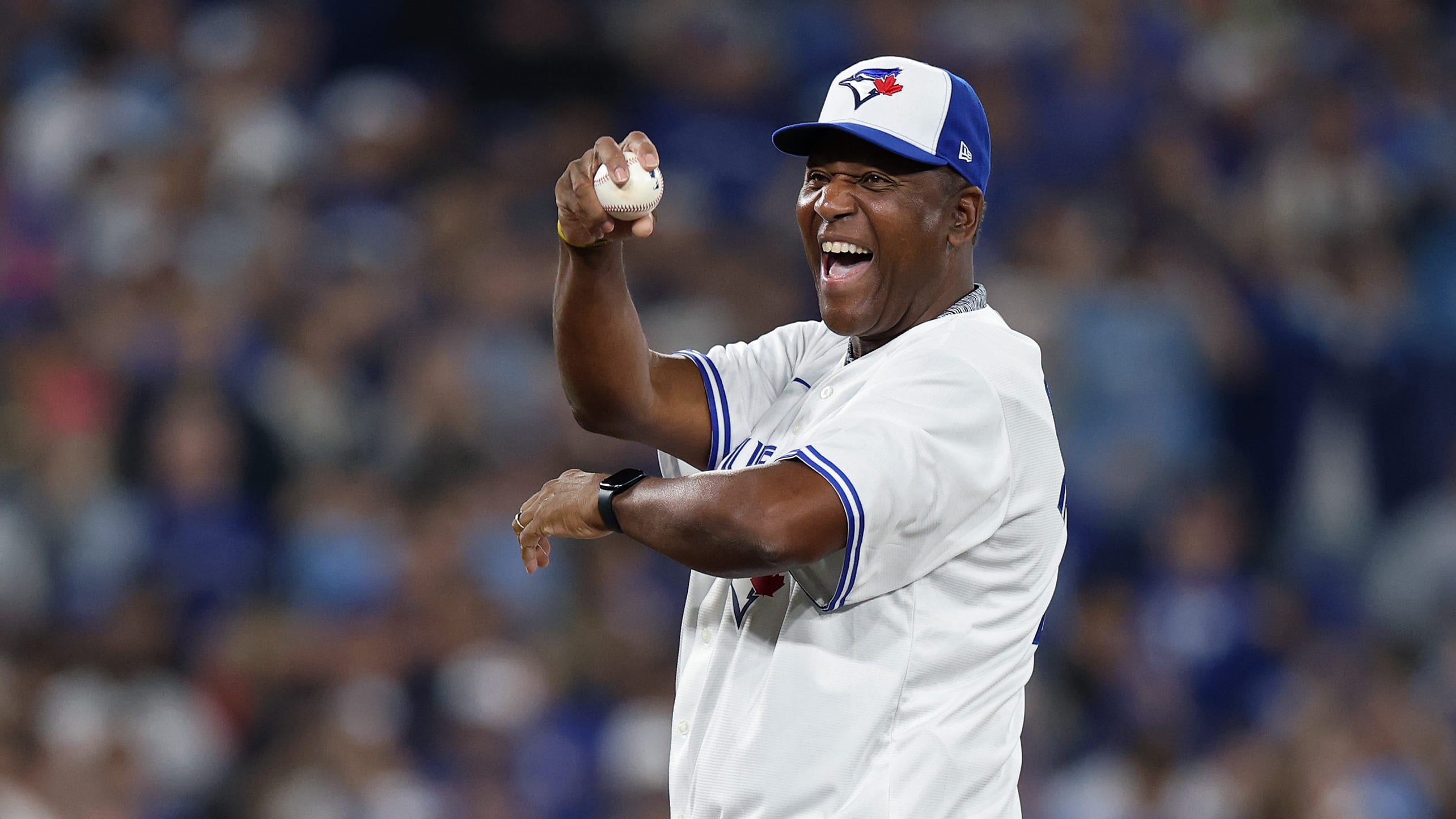 Joe Carter prepares to throw out the first pitch before Game 2