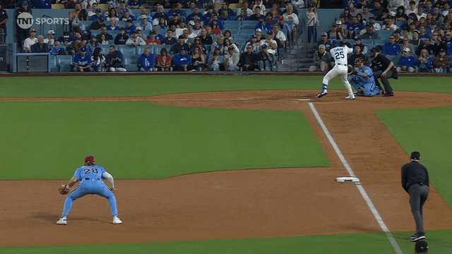 An animated gif of Alec Bohm leaping high into the air to snare a line drive