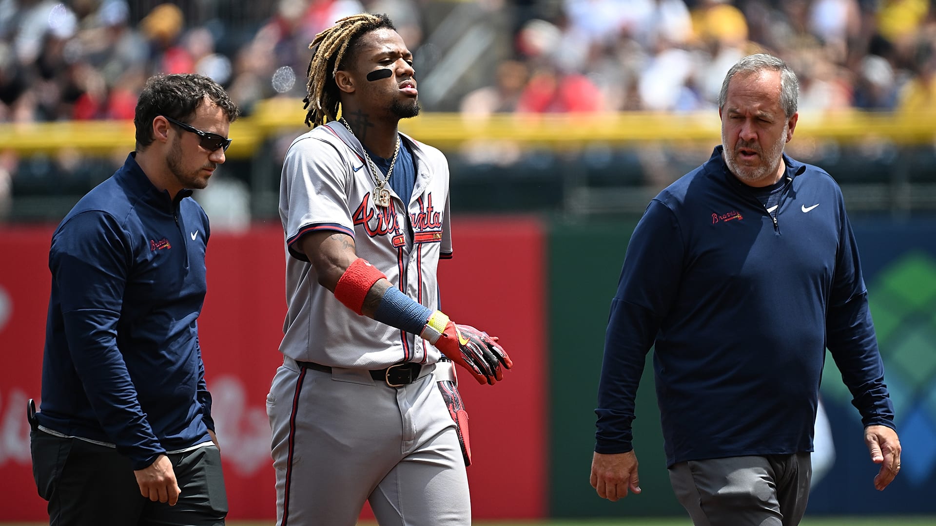 Ronald Acuña is attended to after tearing his left ACL