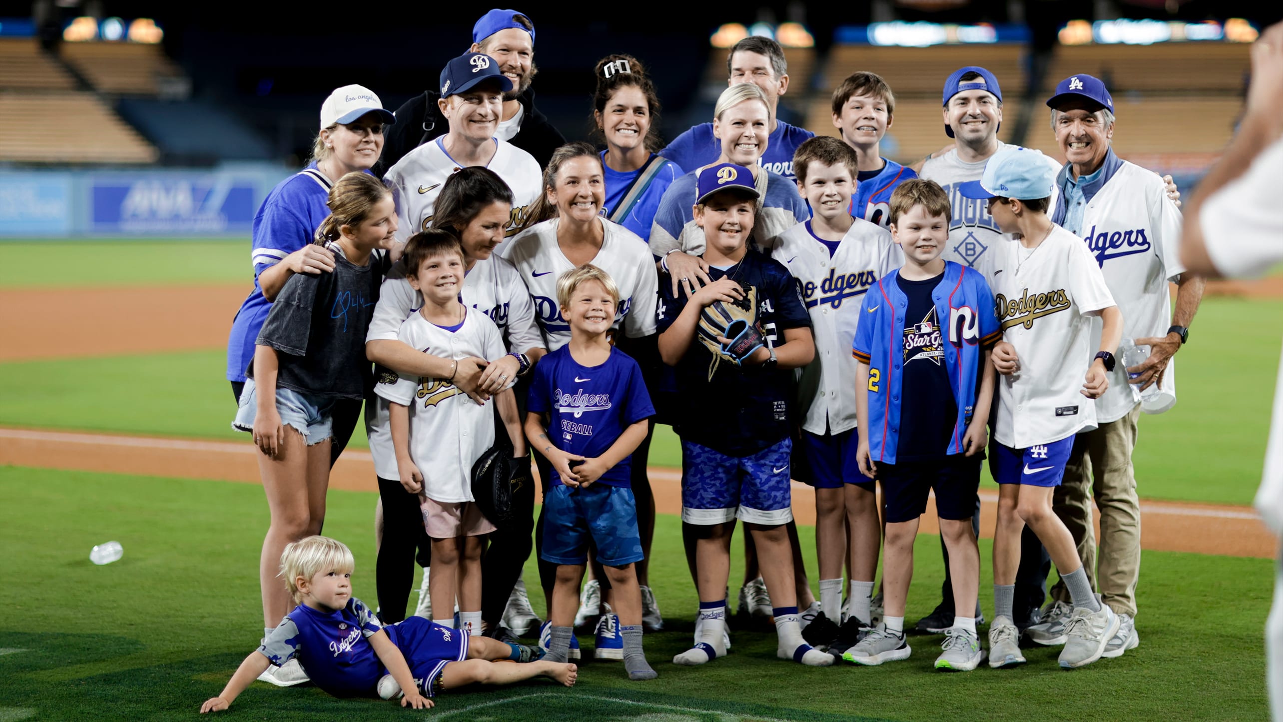 Clayton Kershaw and his family on the field after the game