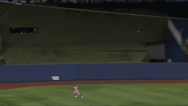 An animated gif of Ceddanne Rafaela racing over and leaving his feet to make a diving catch