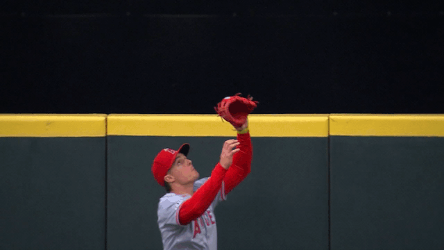 An animated GIF of Mickey Moniak robbing a home run