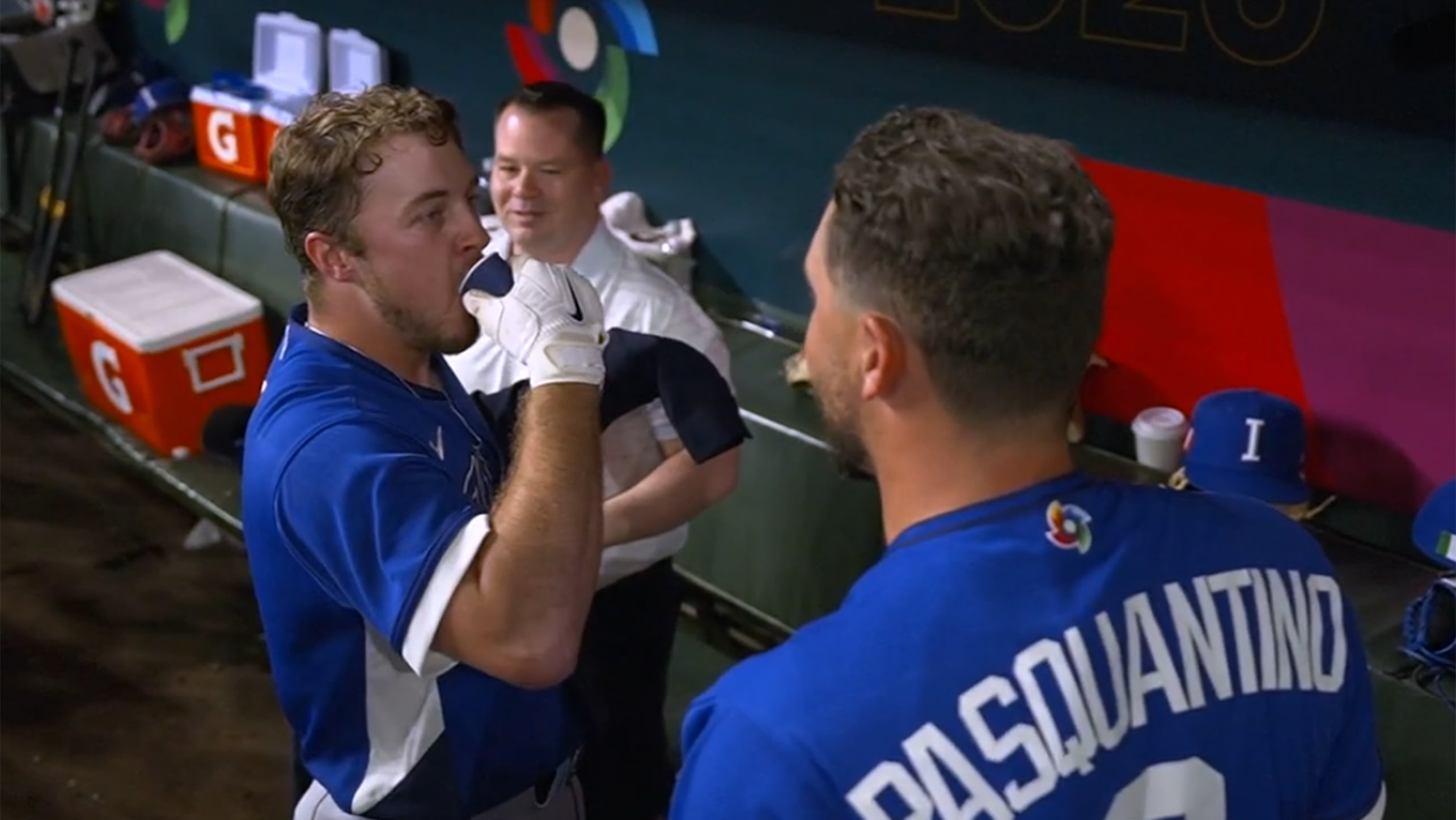 Kyle Teel takes a shot of espresso in the dugout