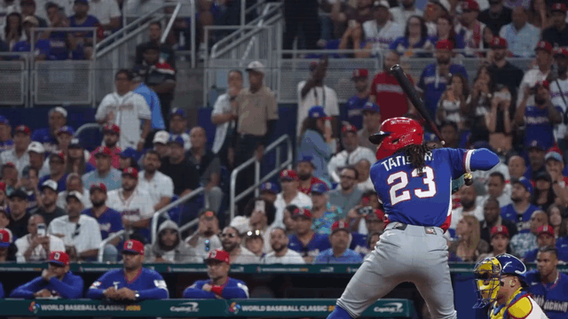 An animated gif of Fernando Tatis Jr. chucking his bat on his follow-through after hitting a no-doubt home run