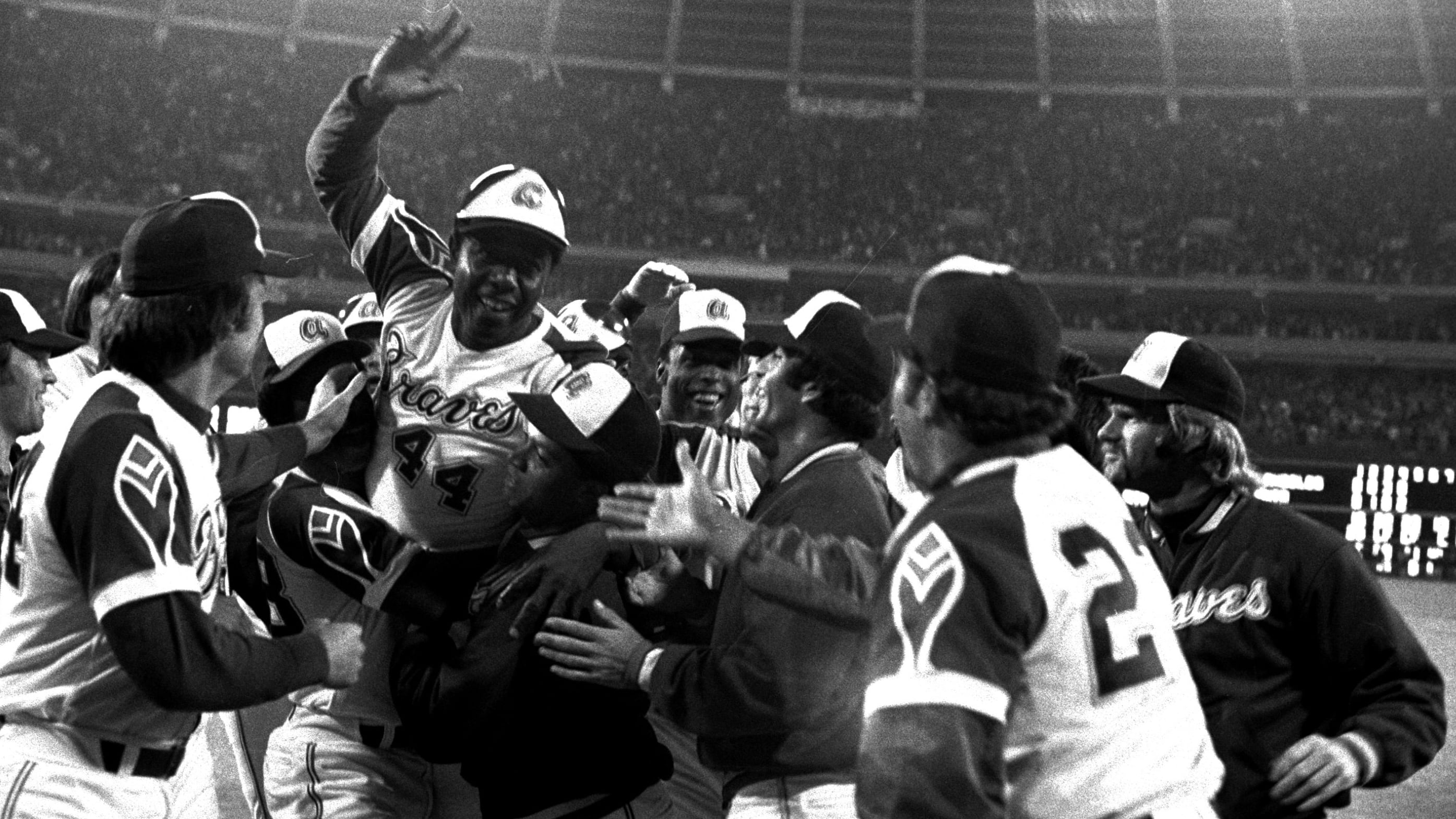 Hank Aaron celebrates with teammates