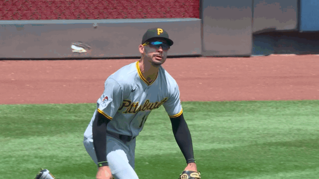 An animated gif of Bryan Reynolds reaching out to make a diving catch