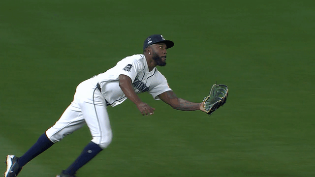 An animated gif of Randy Arozarena making a diving catch