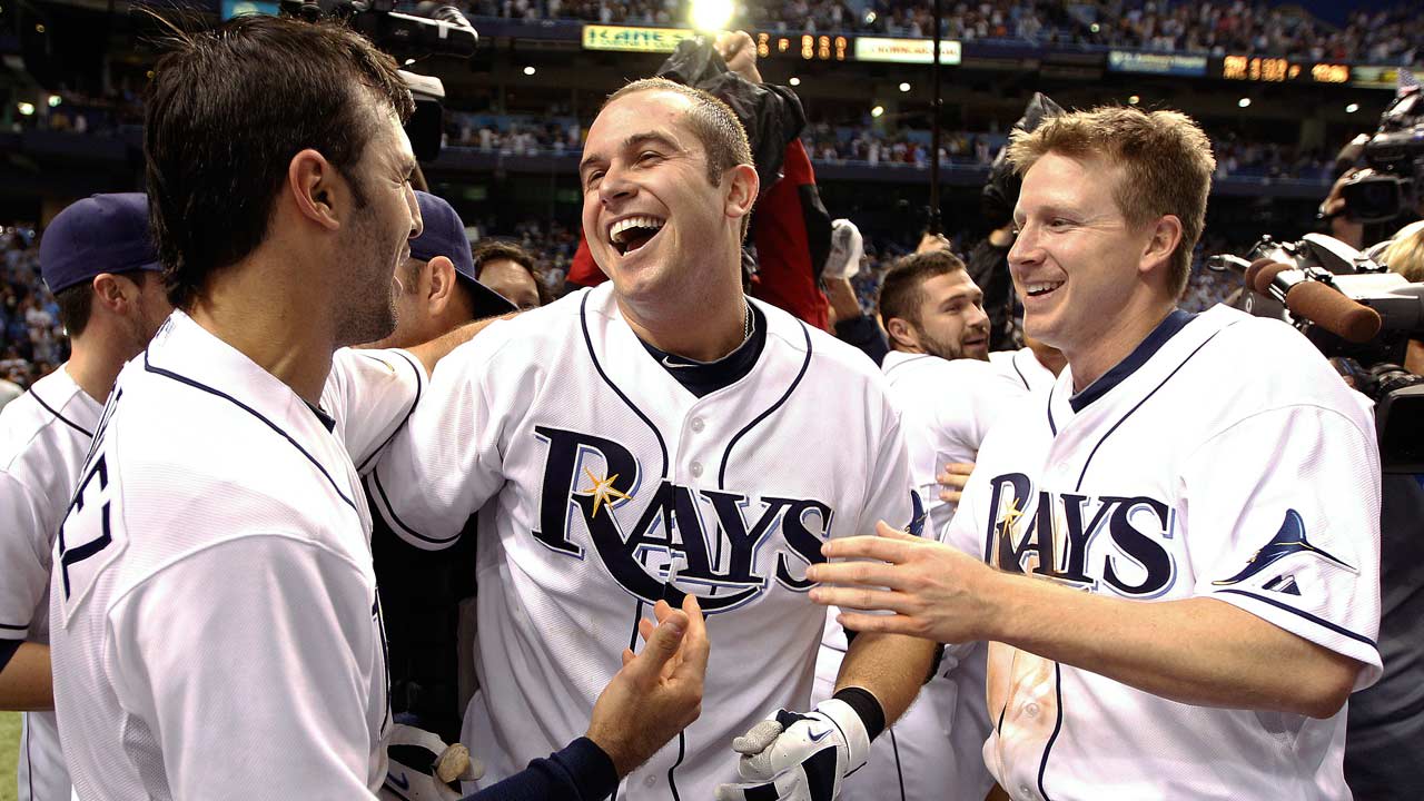 Evan Longoria celebrates with Rays teammates after a walk-off win in 2011