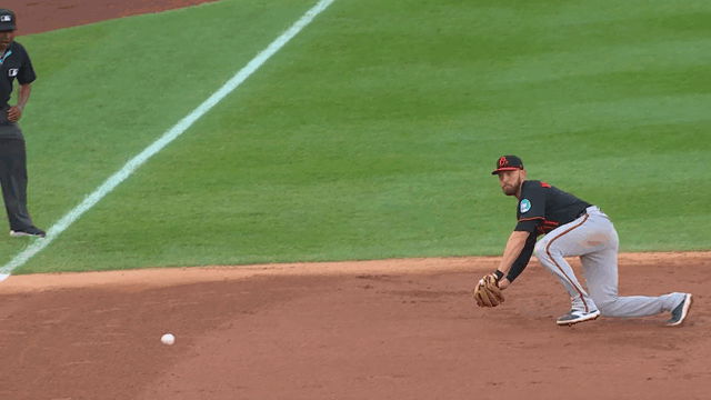 An animated gif of Jordan Westburg making a diving play at third base and throwing to first for the out