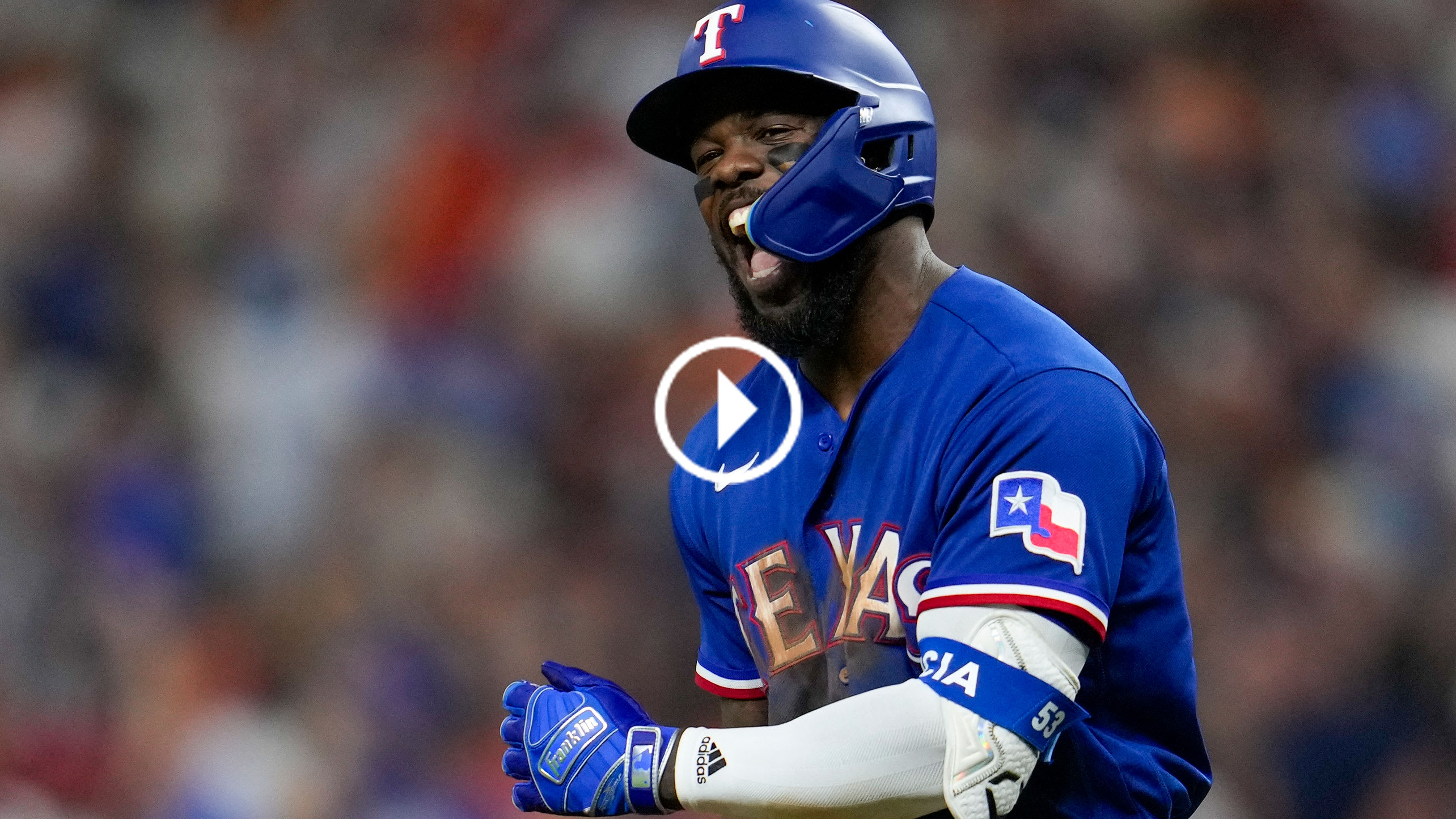 Adolis García shouts after hitting his first home run