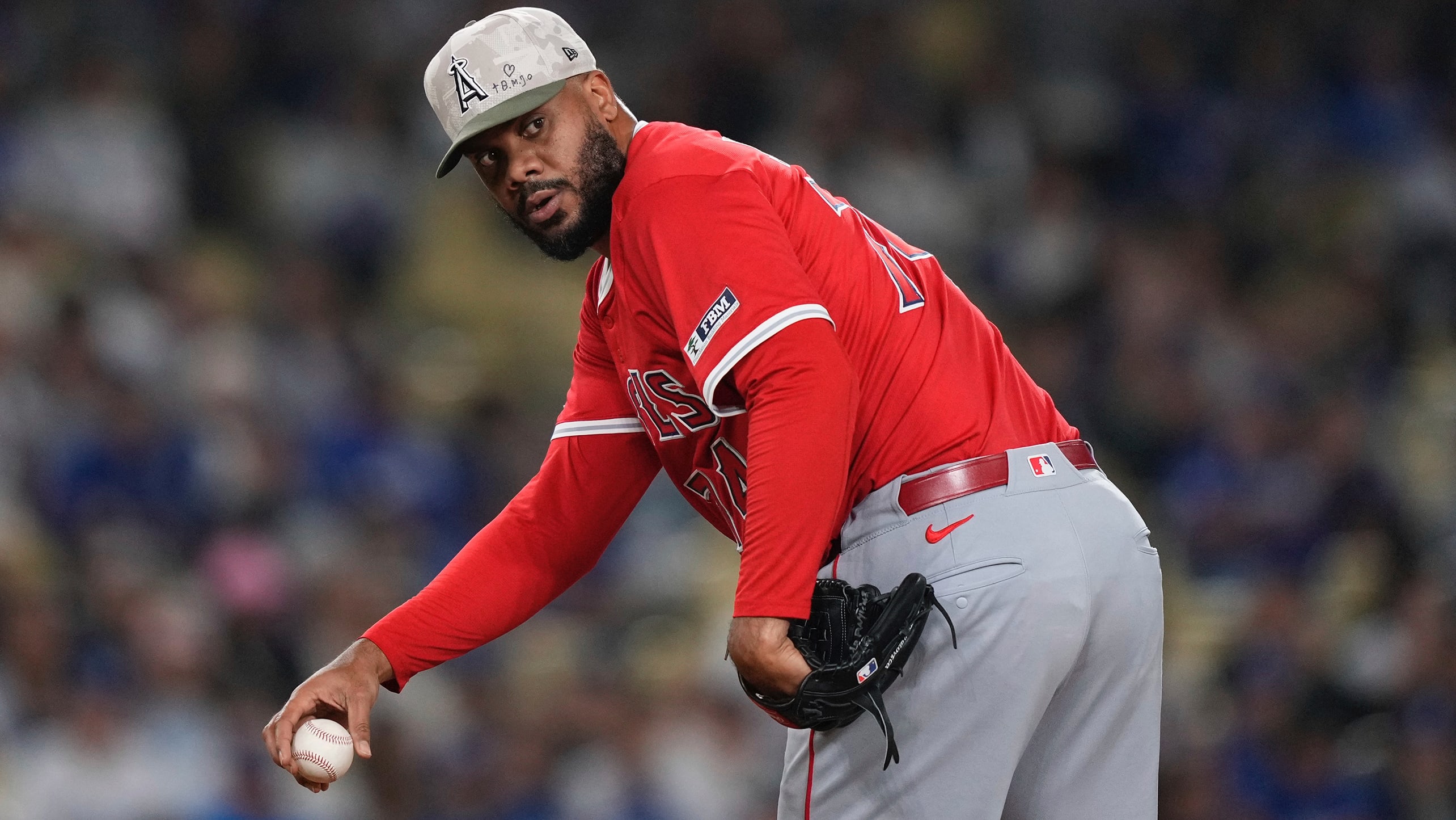 Kenley Jansen looks back as he sets up on the mound