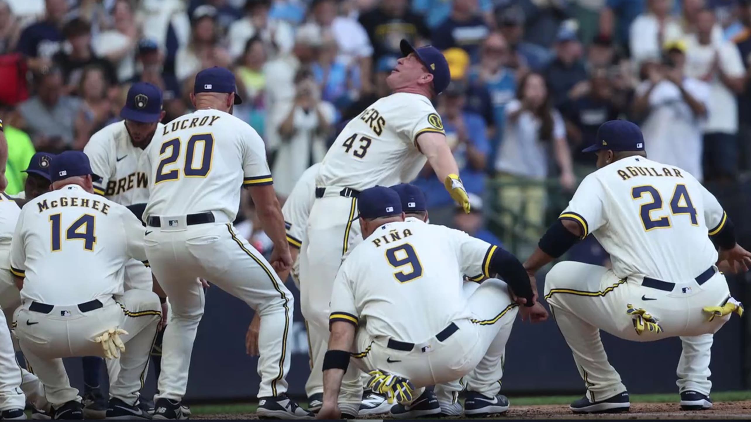Randy Wolf celebrates with Brewers alumni after hitting a home run