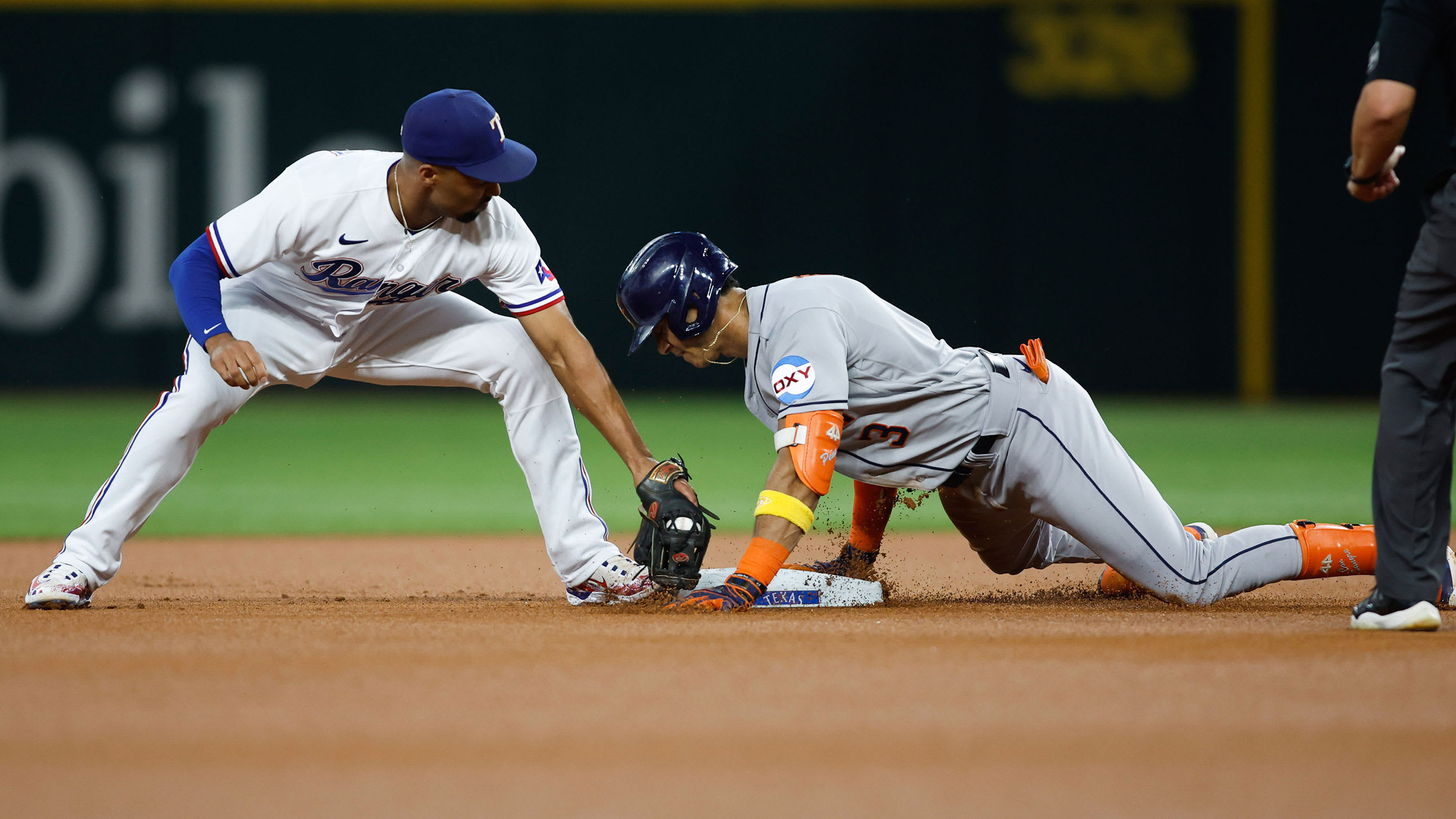 Marcus Semien attempts to tag Jeremy Peña at second base