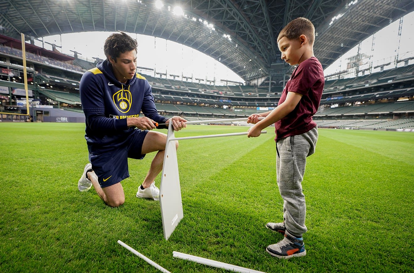 Christian Yelich helping build a bookshelf (Photo: Milwuakee Brewers)