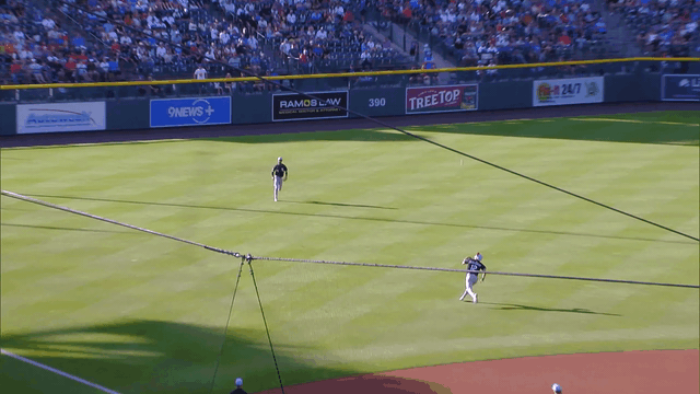 An animated gif of White Sox shortstop Colson Montgomery making an over-the-shoulder diving catch in short left field