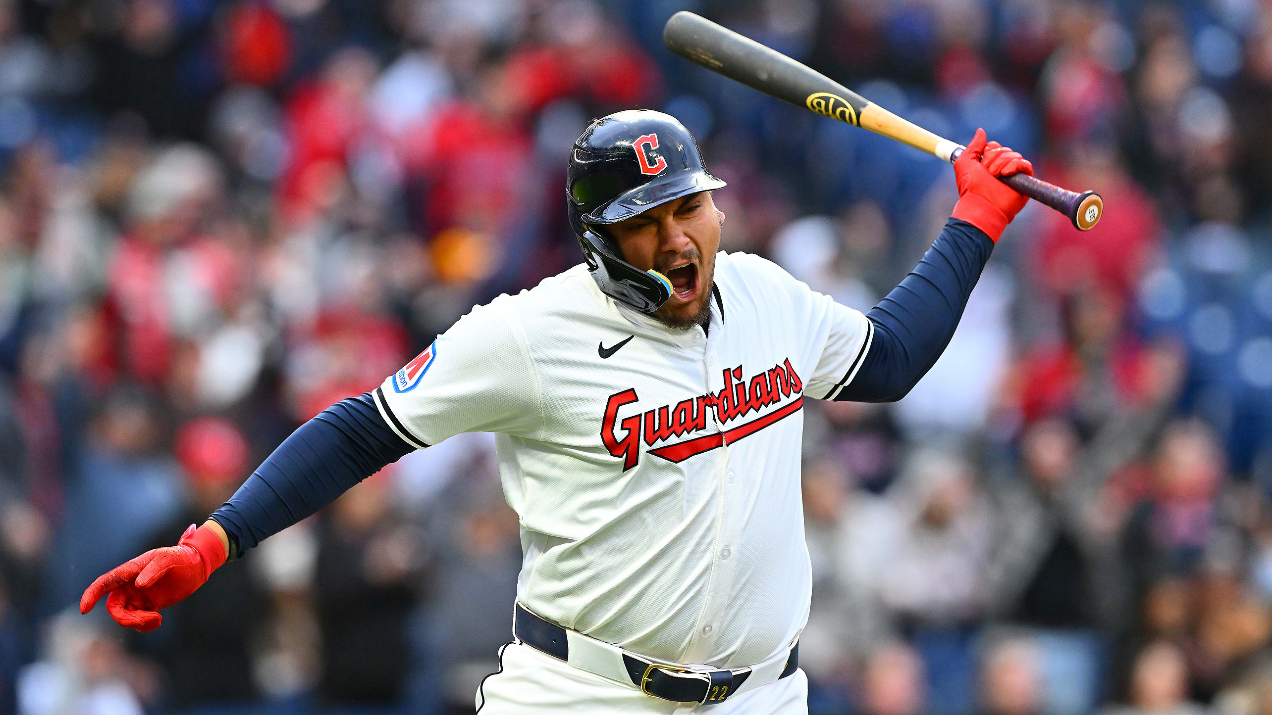 Josh Naylor slams his bat to the ground after a home run