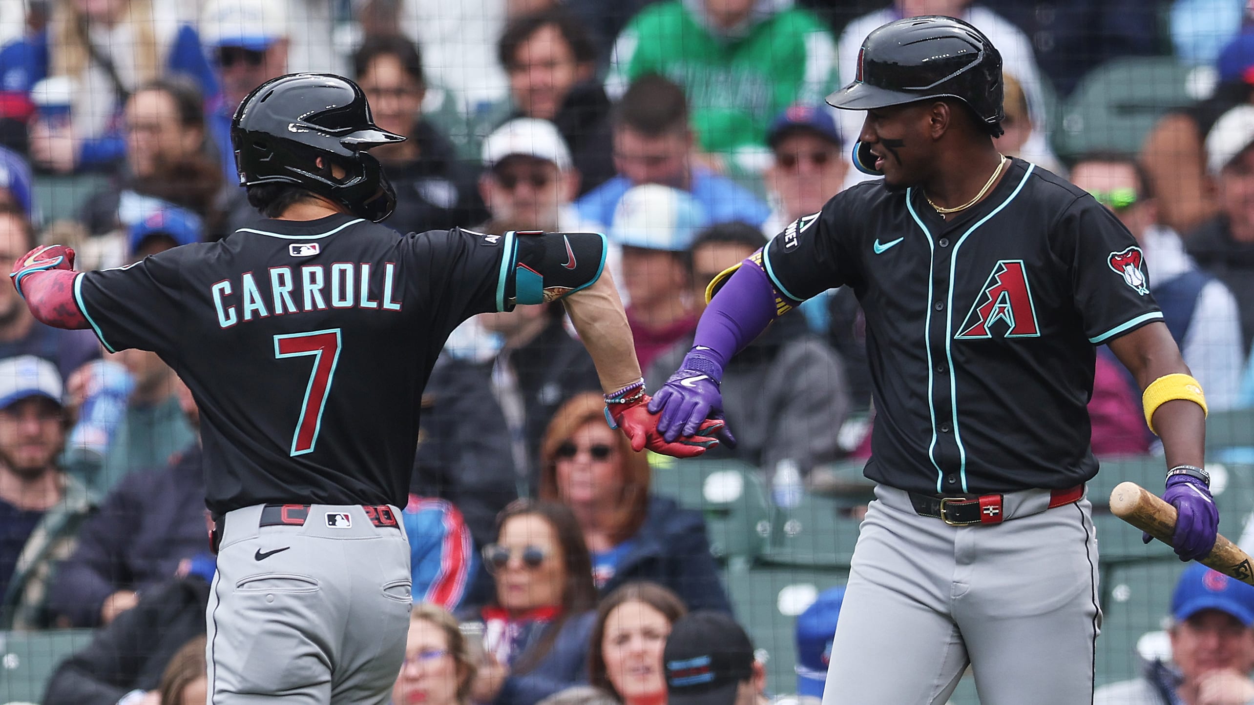 Corbin Carroll and Geraldo Perdomo celebrate after a D-backs run