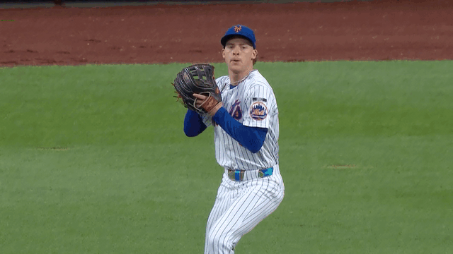 An animated gif of Carson Benge throwing out a runner at home plate