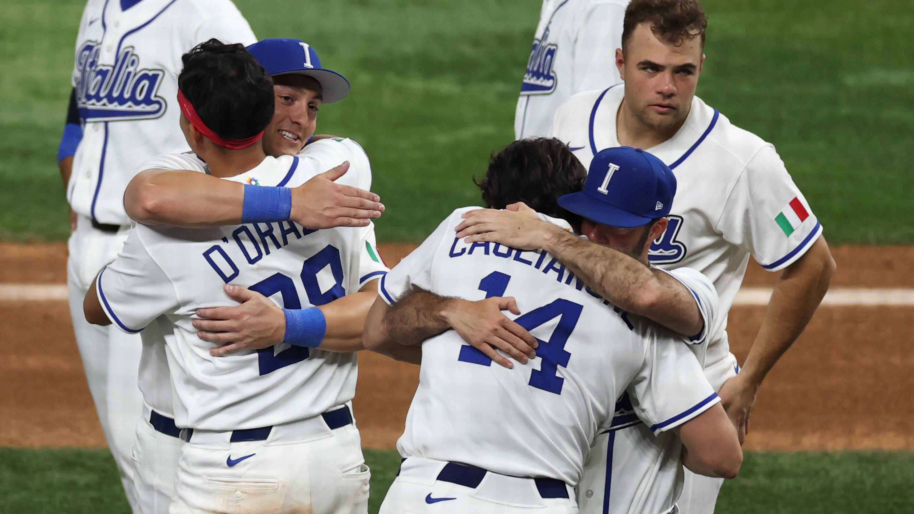 Team Italy hug it out after falling to Venezuela in the semifinals