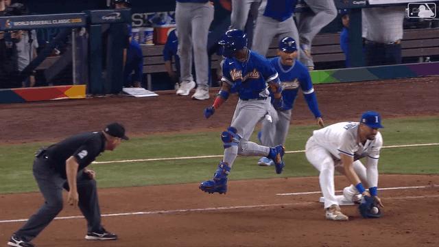 An animated gif of Ronald Acuña Jr. high-stepping down the line after touching first base