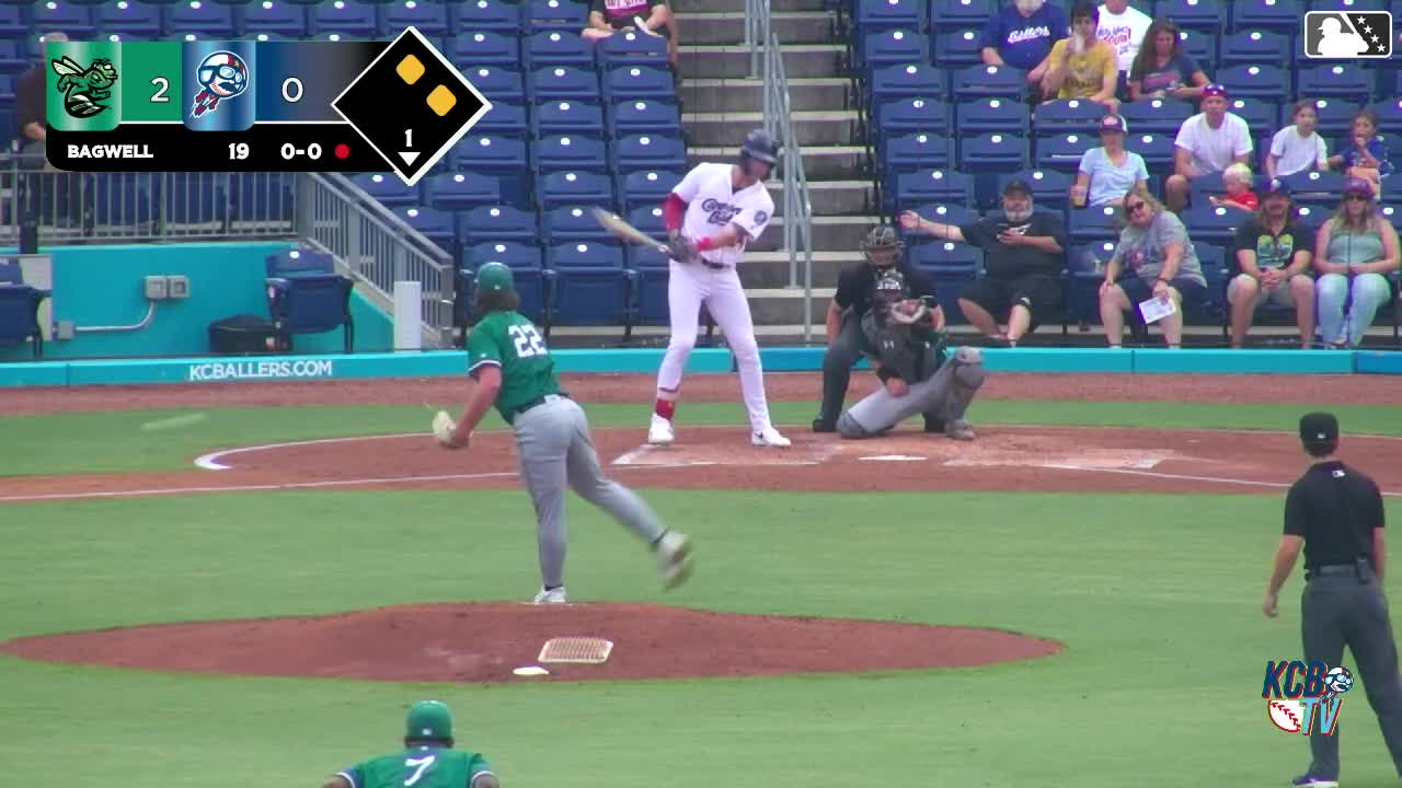 A screengrab of a batter swinging with one hand