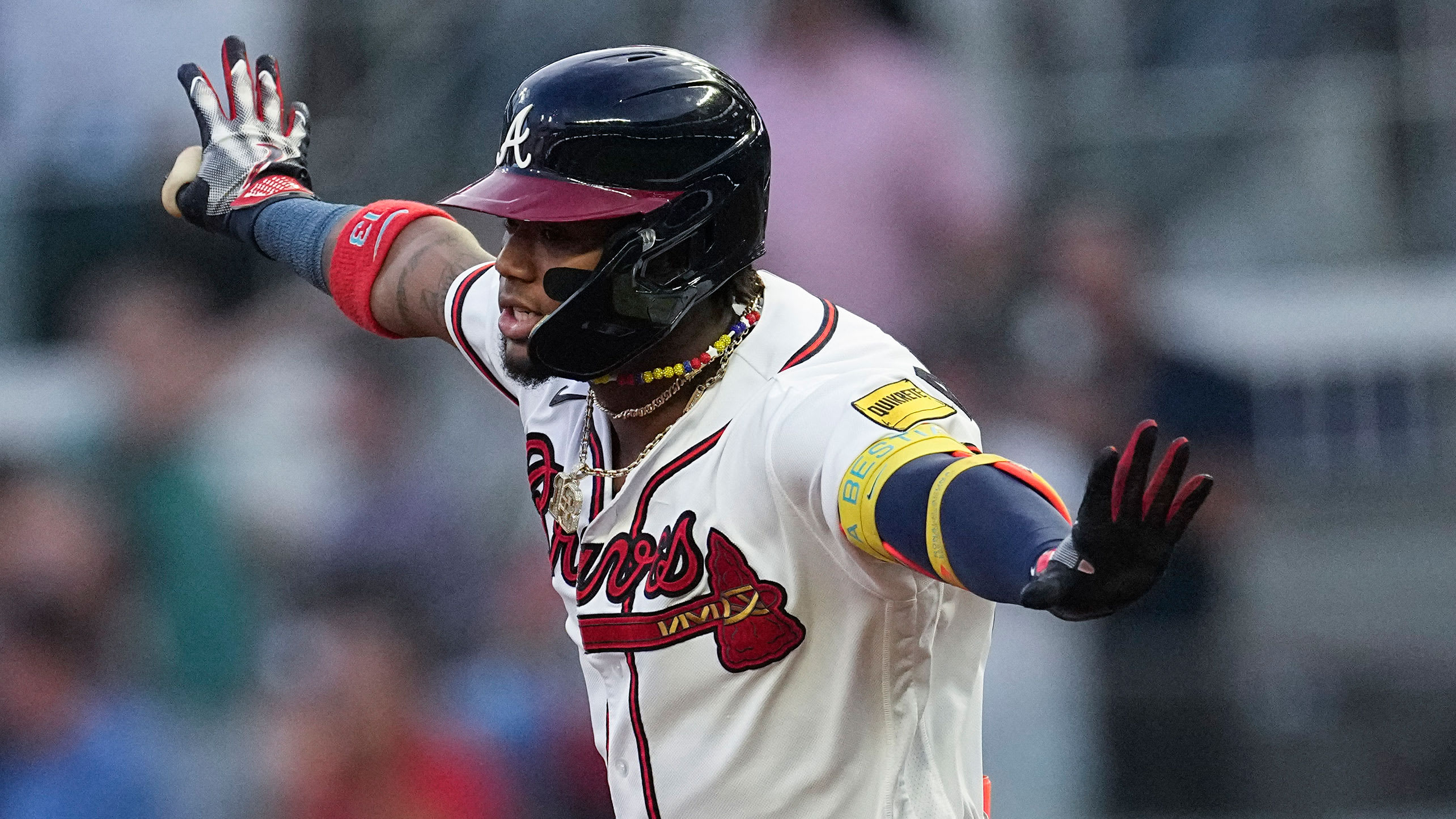 Ronald Acuña Jr. spreads his arms during a home run trot