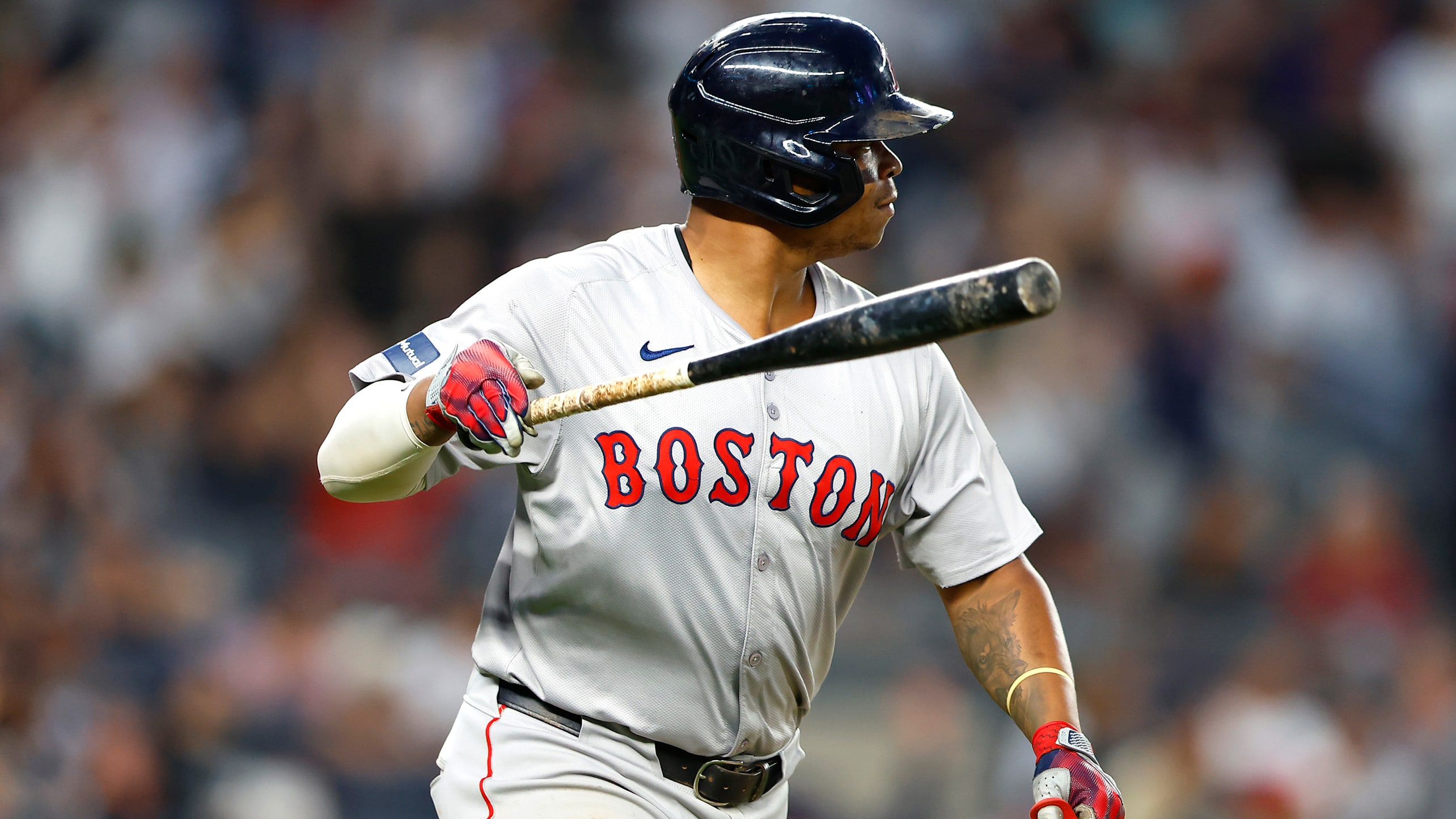 Rafael Devers watches the flight of a home run