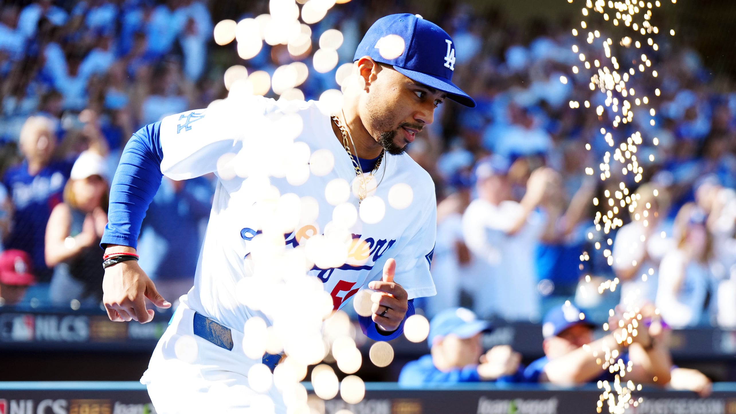 Mookie Betts runs on the field as pyrotechnics are set off 